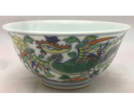 A Chinese Doucai porcelain tea bowlDecorated with a pair of phoenix amongst scrolling blossom, blue painted six character Kan