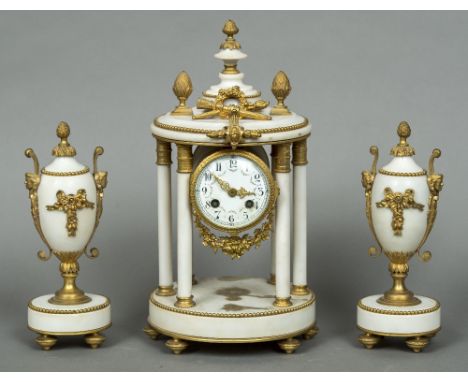 A 19th century gilt metal mounted white marble triple clock garnitureThe white painted dial with Arabic numerals and decorate