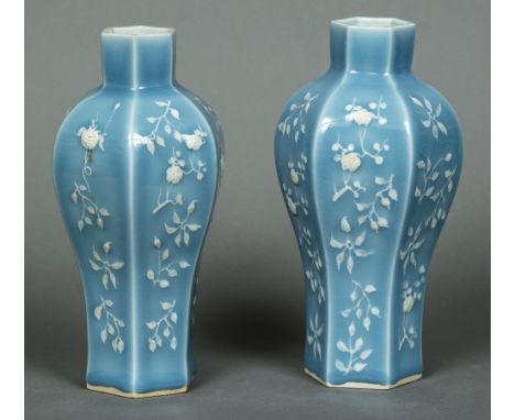 A pair of Chinese celadon ground vasesEach of hexagonal bulbous tapering form, decorated with floral sprays, the underside wi
