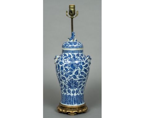 A Chinese blue and white porcelain lidded vaseThe lid with a dog-of-fo finial, the main body with twin mask and loop handles,