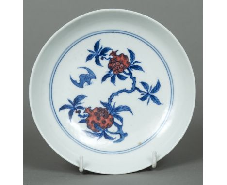 A Chinese porcelain dishThe interior decorated with a bat amongst fruiting stems, the underside decorated with bats amongst s