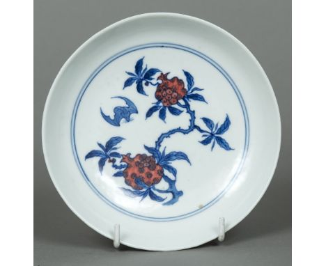 A Chinese porcelain dishThe interior decorated with a bat amongst fruiting stems, the underside decorated with bats amongst s