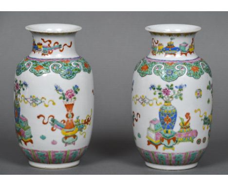 A pair of late 19th/early 20th century brightly painted Chinese porcelain vasesDecorated with precious objects, each with Qia