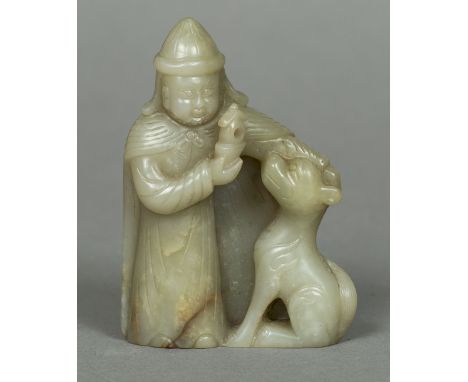 A Chinese carved celadon and russet jade figureWorked as a Middle Eastern gentleman and his dog.  10.5 cm high.    CONDITION 