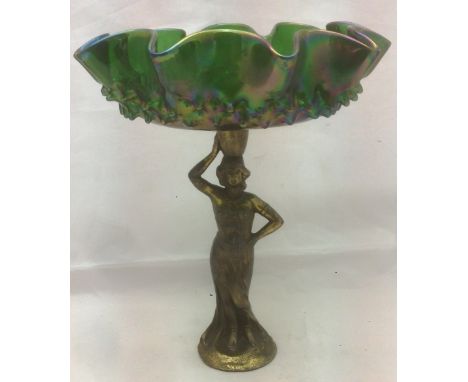 A Continental Art Nouveau iridescent glass and spelter figural tazzaThe shaped moulded bowl supported on a classical figure. 