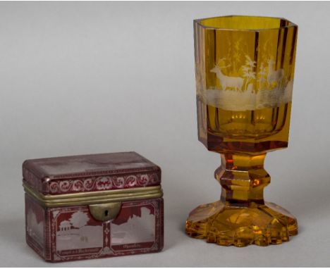 An amber coloured Bohemian glass gobletEngraved in the round with deer; together with a 19th century Bohemian ruby flash tea 