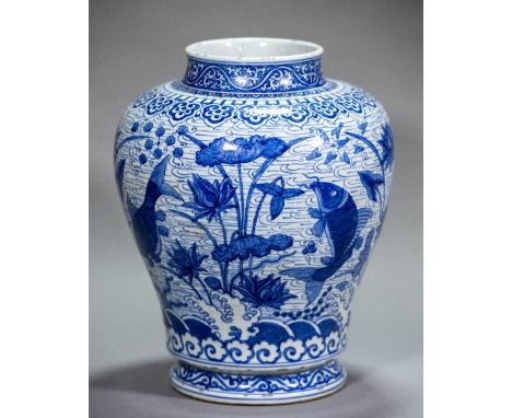 A large Chinese blue and white porcelain fish vaseOf baluster form, decorated with four pond fish amongst aquatic plants inte