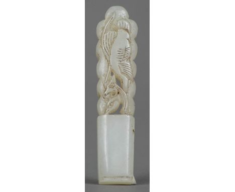 A Chinese carved white jade pendantWorked with a phoenix.  6 cm long.    CONDITION REPORTS:  Generally in good condition, exp