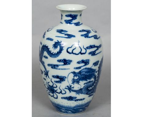 A Chinese blue and white porcelain dragon vaseDecorated with five-clawed dragons chasing a flaming pearl within stylised clou