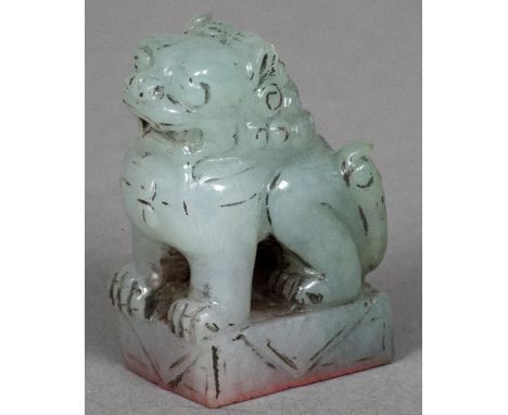 A Chinese carved jade sealFormed as a dog-of-fo.  4.5 cm high.    CONDITION REPORTS:  Some minor fritting, chipping, general 