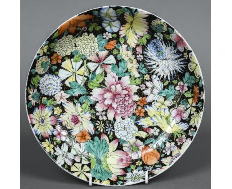 A Chinese porcelain plate Decorated in the Millefleur pattern, the underside with iron red painted seal mark.  23.5 cm diamet