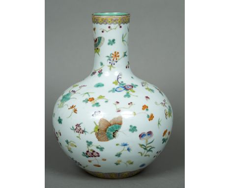 A Chinese porcelain vaseOf bulbous form, decorated in the round with butterflies amongst trailing foliage, the underside with