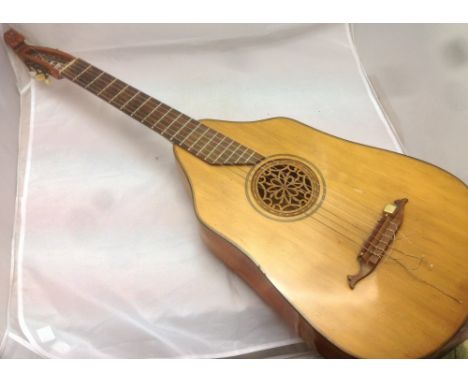 A German lute guitarOf typical construction.  102 cm long.   CONDITION REPORTS:  Generally good condition, expected wear, two