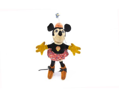 A very rare Steiff Walt Disney’s Minnie Mouse 1932-36, of white and black velvets, black oil-cloth ‘pie-cut’ eyes, cotton whi