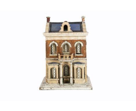 A Gottschalk blue roofed dolls' house, painted cream with brown lining, brick paper to first floor, central front door with p