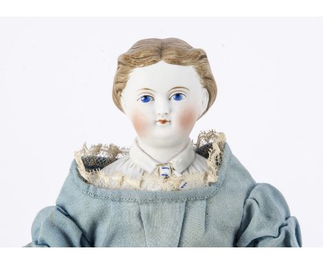 A Kling bisque shoulder head doll with moulded collar,  with blue painted eyes, white highlight dot, red eyelid line, pale br