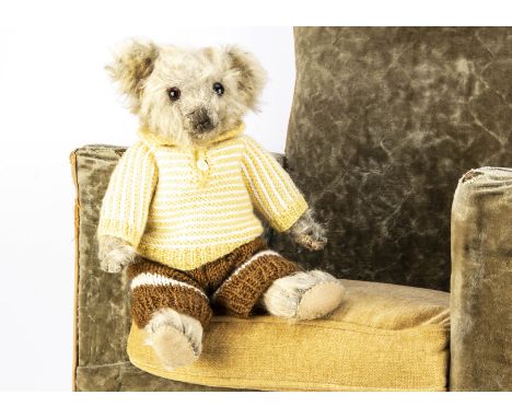 A 1930s Merrythought teddy bear,  with light golden mohair, orange and black glass eyes, pronounced muzzle, black stitched no