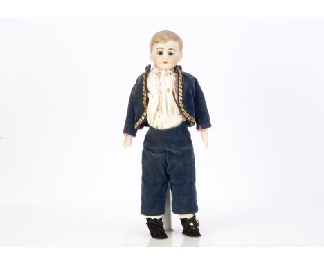 A German bisque shoulder head boy doll, possibly Kling with fixed brown glass eyes, closed mouth, dark brown, brown painted a