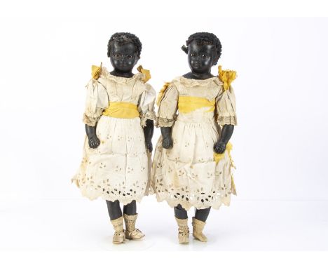 Two rare English black wax twin dolls late 19th century, the reinforced black wax shoulder-heads turned slightly to the right