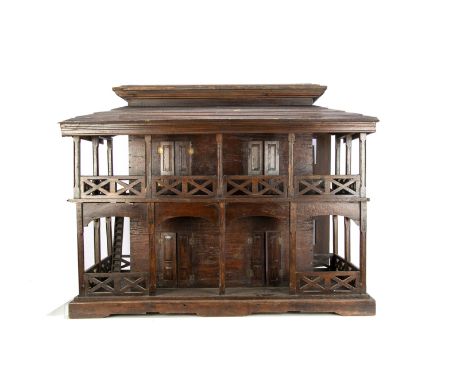 A late 19th century Colonial style teak dolls’ house,  of two stories, veranda and balcony around three sides, shuttered wind