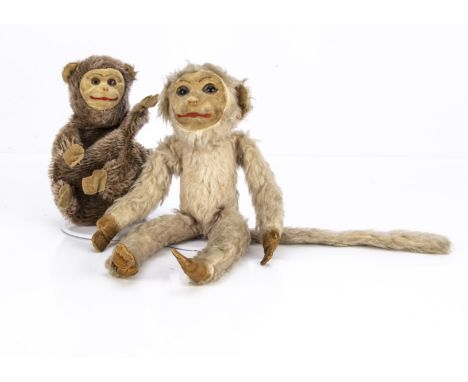 A Norah Wellings Trikko monkey 1930s, with beige wool plush, inset glass eyes, moulded velvet face, ears, hands and feet and 