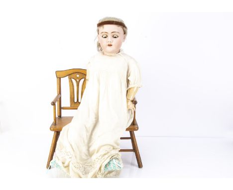 A large Heinrich Handwerck 109 child doll,  with brown sleeping eyes, pierced ears, blonde mohair wig, eight ball jointed com