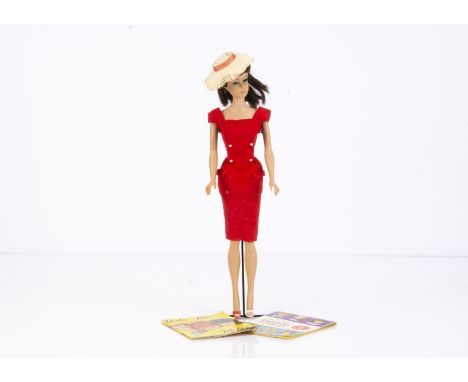 A Mattel brunette Swirl Pony Tail Barbie,  in Sheath Sensation, stand and two catalogues (missing gloves and shoe)