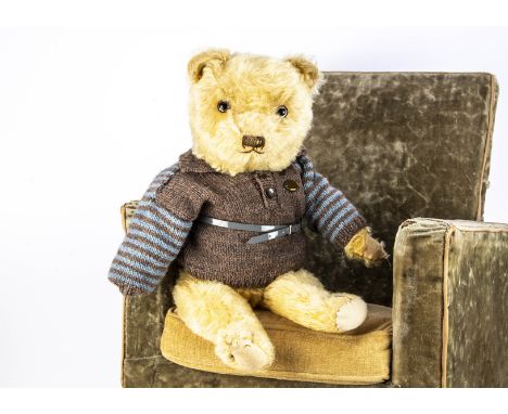 A British 1940/50s British teddy bear, with golden mohair, clear and black glass eyes with brown painted back, swivel head, j