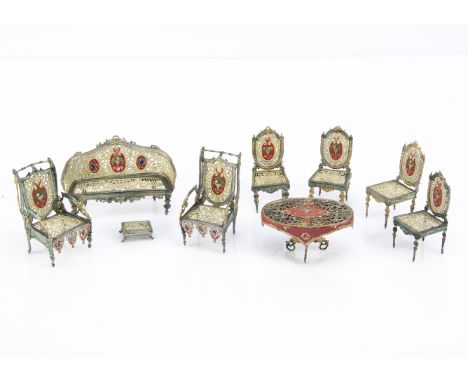 A rare set of German soft metal dolls’ house sitting room furniture, pierced metal painted in green and cream with red, gold 