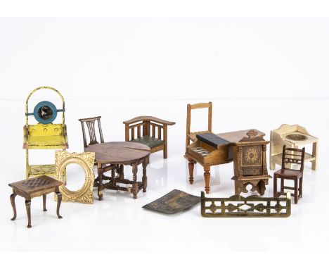 Various dolls’ house furniture, a Schnegass grand piano -5 1/4in. (13.5cm.) long; an oak wall clock with printed face; a yell