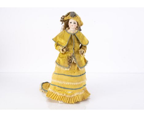 A Francois Gaultier pressed bisque fashion doll, with blue glass eyes, dark rim to iris, light brown brows, closed pink mouth