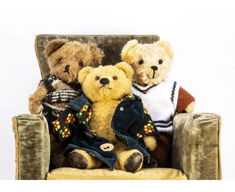 Three post-war British teddy bears, including a golden wool plush, orange and black glass eyes, black felt nose, fixed neck, 