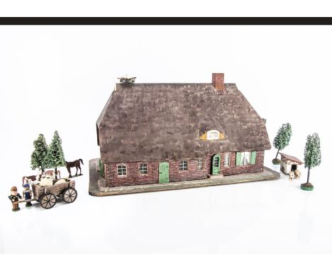 An unusual painted wooden model Dutch-style farm house,  brick painted with straw painted lift-off roof and first floor to re