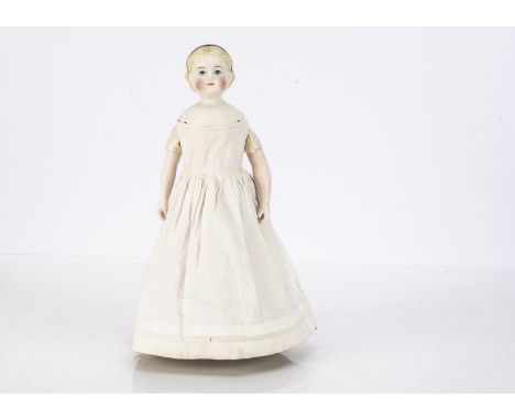 A rare mid 19th century bisque shoulder head doll with unusual wooden roller walking mechanism, with large blue painted eyes,