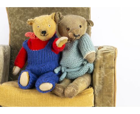 Two 1930s British teddy bears, with orange and black glass eyes, black stitched nose, swivel head, jointed limbs and blue kni