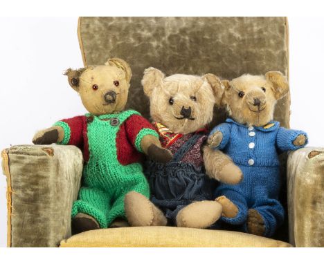 Three British teddy bears,  one with pink mohair, orange and black glass eyes, black stitched nose, swivel head, jointed limb