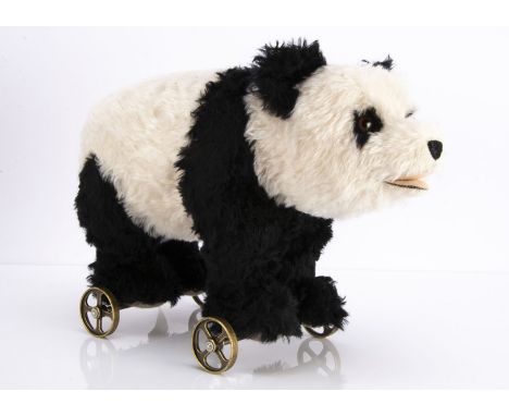 A large Steiff limited edition 1938 replica Panda on wheels, 426 of 1000, in original box with certificate and outer packagin