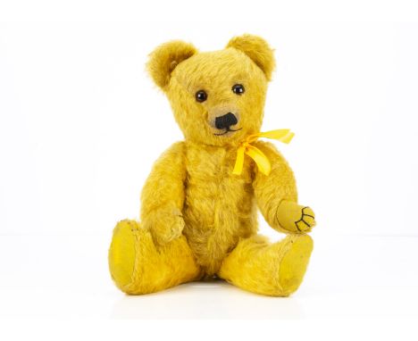 An unusual Merrythought yellow mohair teddy bear 1930s,  with orange and black glass eyes, pronounced clipped muzzle, black s