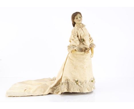 A rare Lucy Peck poured wax bridal shoulder-head doll,  with head turned to the right, inset pale blue glass eyes with a dark