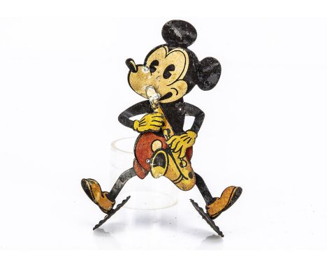 A rare German lithographed tinplate early Mickey Mouse saxophonist toy late 1920s, two-dimensional mouse with pie-cut eye, a 