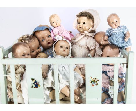 Ten composition baby dolls, the largest --21in. (53cm.) high; another in pink original dress and bonnet, which was Mary's fir