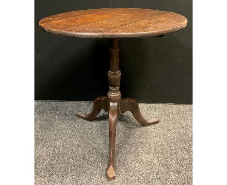 A George III oak tripod occasional table, 71cm high x 71.5cm diameter. 