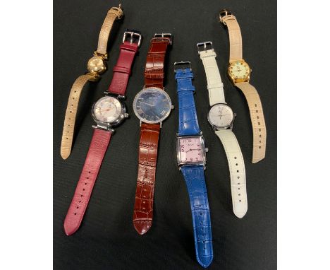 A birth stone multi gem wristwatch, cream dial, gemstone baton markers stones include Garnet, Sapphire, Topaz, Ruby, Tourmali