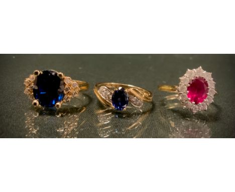 A 14ct gold DQCZ diamond and sapphire effect dress ring, 3.1g gross another stamped 10KUC585, 4.3gross, another ruby and diam