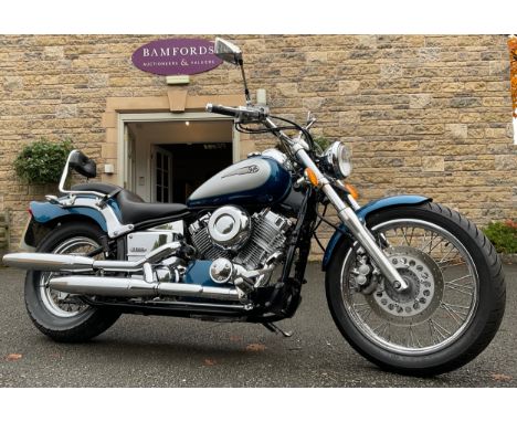 A Yamaha XVS650 Dragstar motorcycle, first registered 1/7/1999, showing 14,136 mileage, registration number T185 GFP, blue an