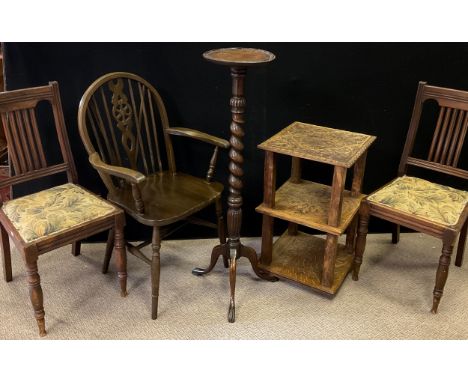 A carved oak side table, the square top carved with scrolling thistle stems within a quartre-foil panel, 69.5cm high x 42cm; 