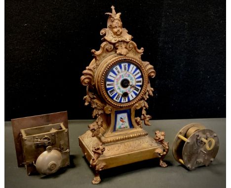 A 19th century French gilt metal and porcelain mounted mantel clock, c.1870; two clock movements (3) 