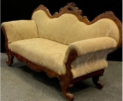 A Victorian Louis XV revival walnut sofa, serpentine-shaped back, rococo carved c-scrolls and leaves, scroll arms, upholstere