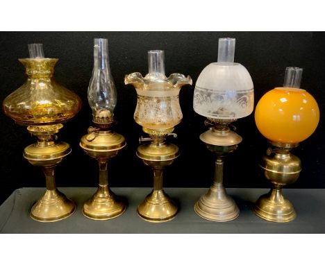 A Victorian brass oil/paraffin lamp, frosted etch glass shade, others amber glass, etc.(5) 