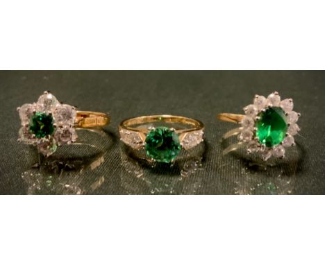 A 14c gold DQCZ emerald and diamond effect snowflake cluster dress ring, other oval cluster, etc, sizes N-O, 9.6g gross (3) 